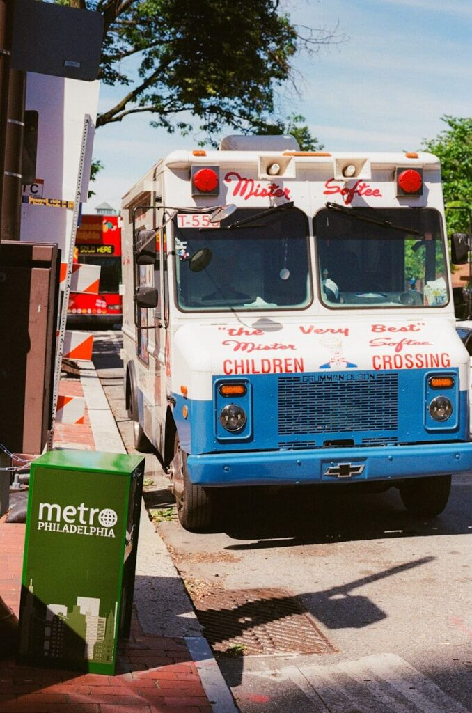 Mister softee ice cream truck on a sunny city street.